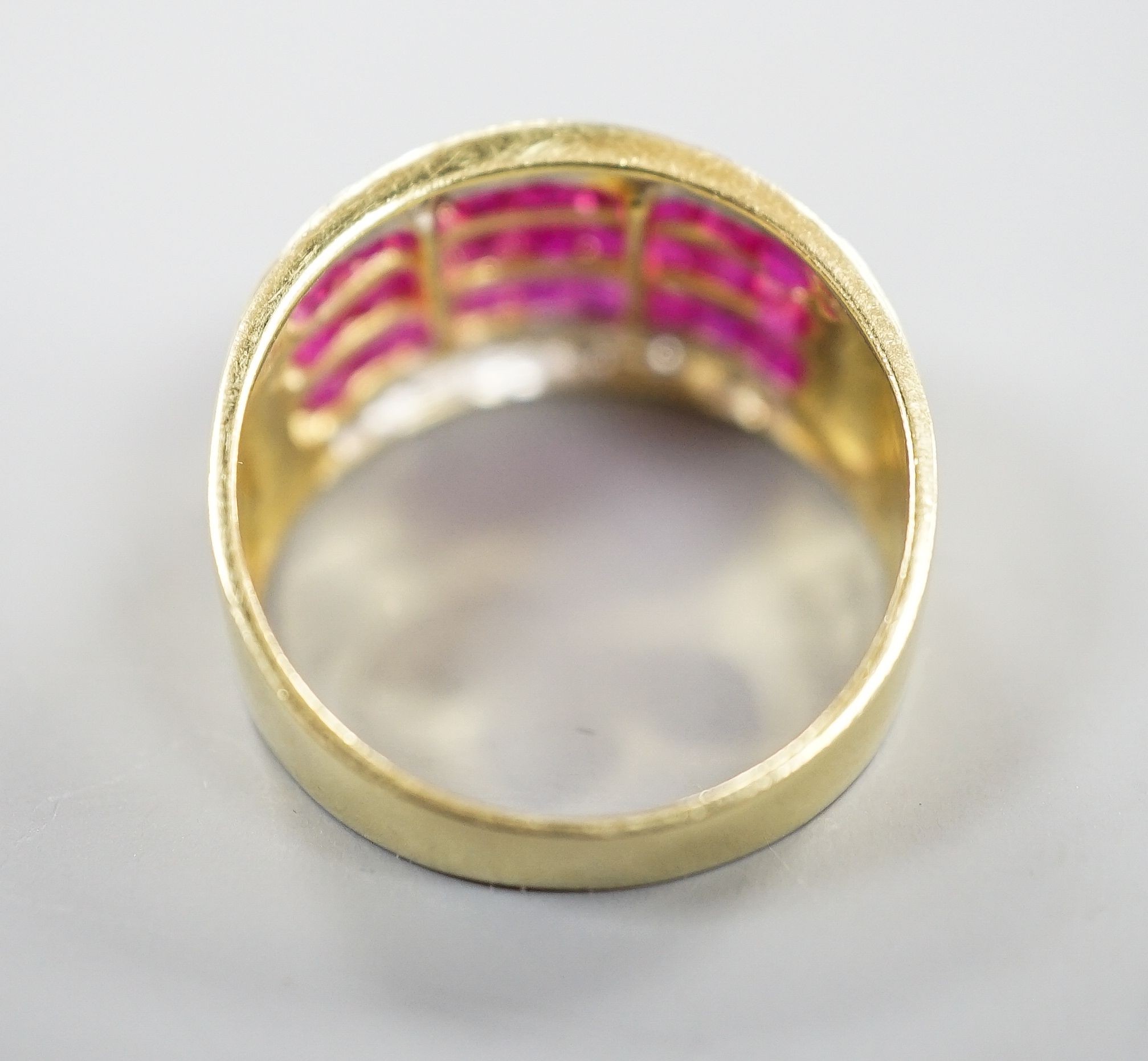 A modern 14k yellow metal, five row ruby and diamond set dress ring. size O, gross weight 4.9 grams.